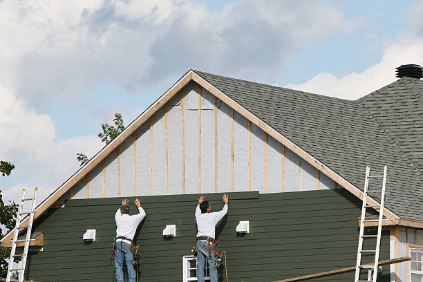 Professional Siding Installation technician working in Port Jefferson, NY